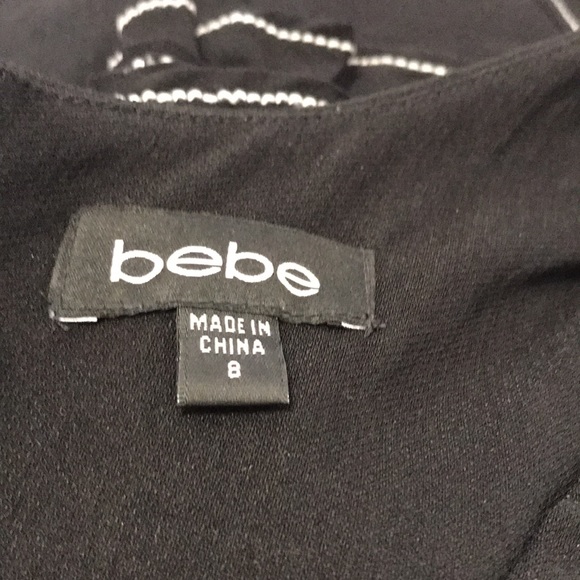 Bebe mechanical fabric peplum dress. - Picture 10 of 11